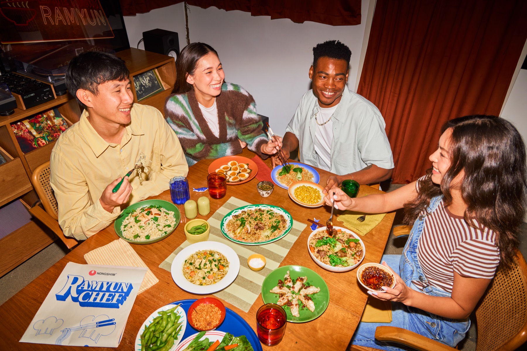 Four friends sharing Ramyun Chef dishes around a table